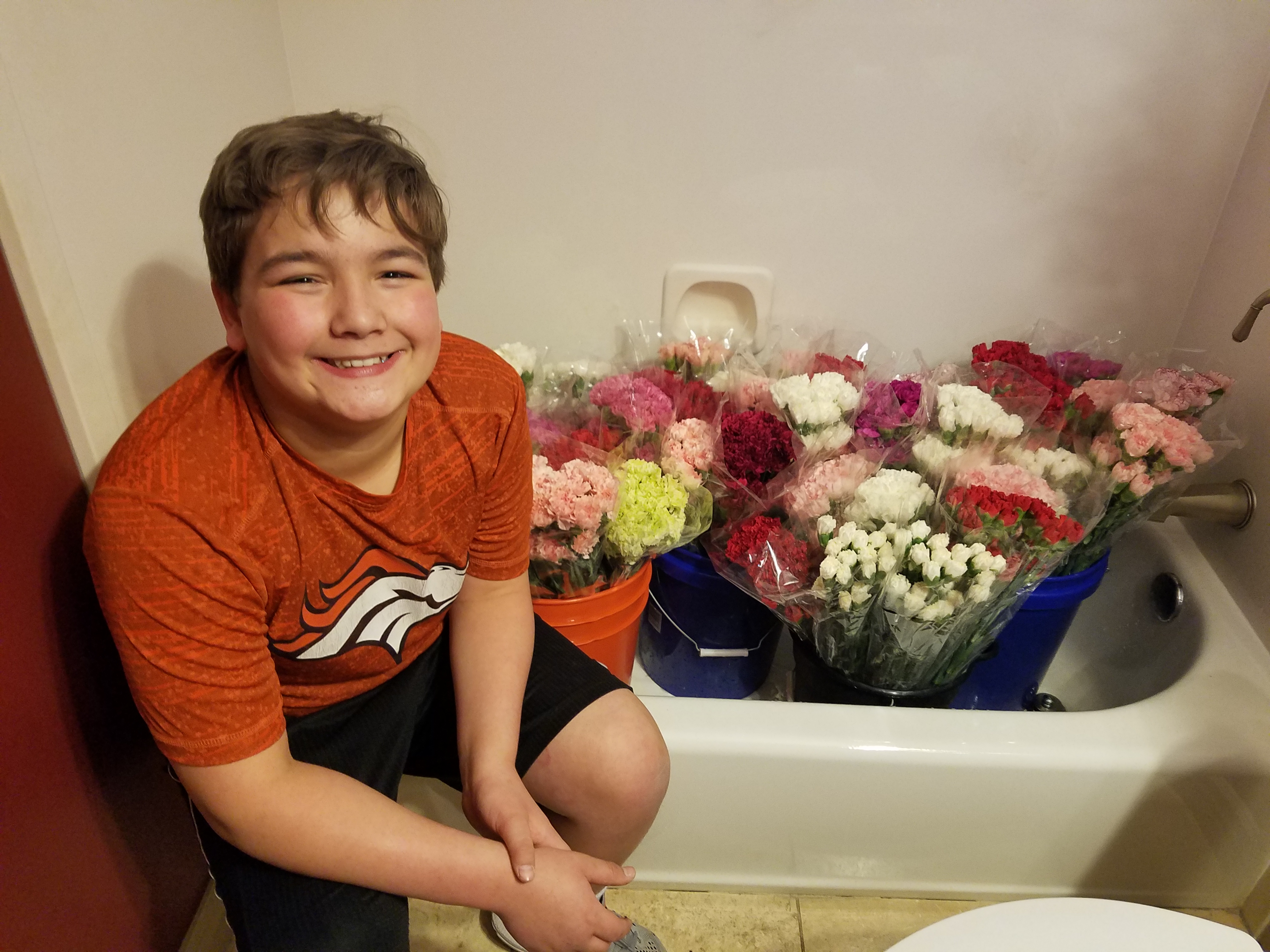 Meet the inspiring eighth-grader who bought 947 carnations for 947 young ladies